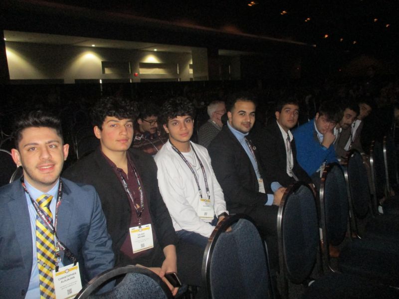 Sajed with fellow Nu Rho Psi members at the SfN plenary