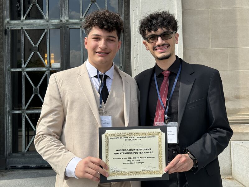 Sajed holding the MiSfN Undergraduate Outstanding Poster Award certificate